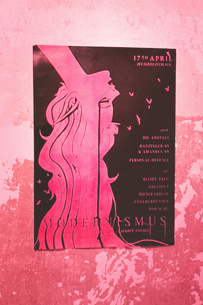 Poster design for Modernismus 12, an underground techno and live music event in Berlin, showing a vampire woman hanging upside down, pink portrait, 2D illustration made by hand and in Photoshop, poster hanging on a wall